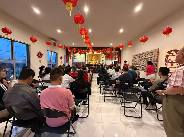 A full hall of people gathered for learning and celebration